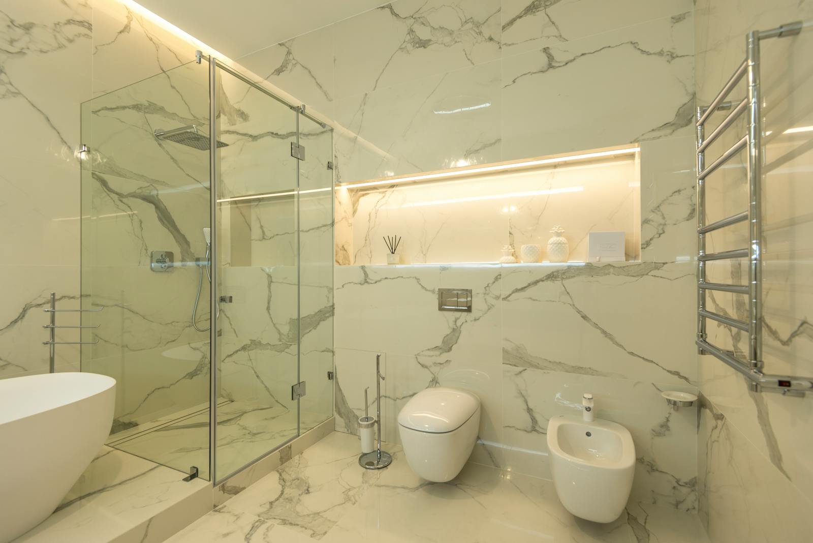 Modern marble bathroom with a floating toilet installed by Ottawa Plumbing Service